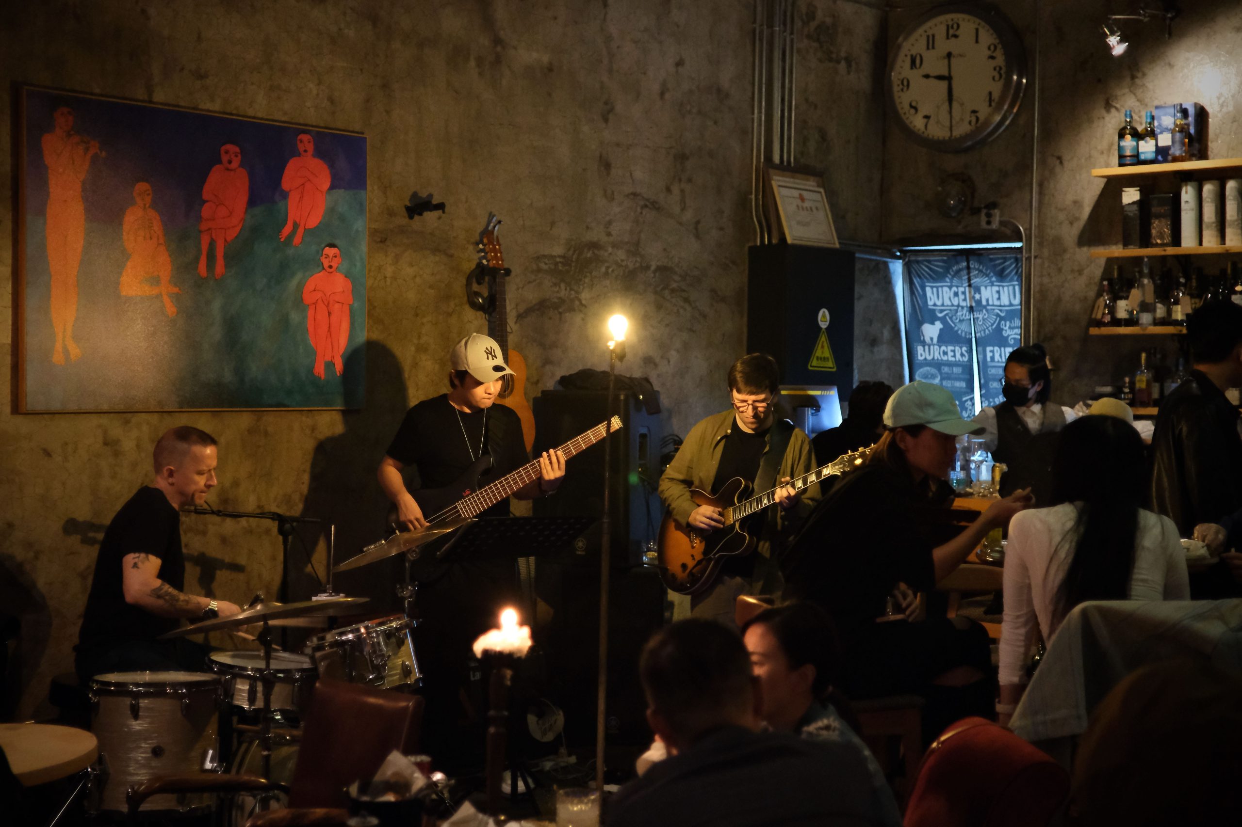 A group of people playing instruments AI-generated content may be incorrect.