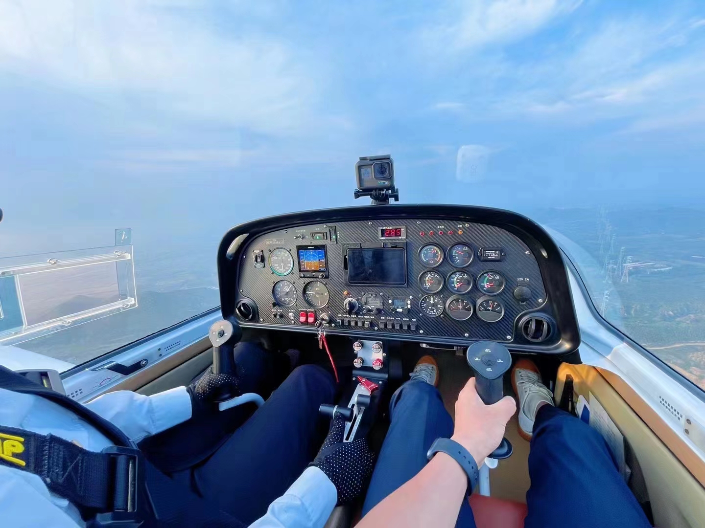 A person in a cockpit of a plane AI-generated content may be incorrect.